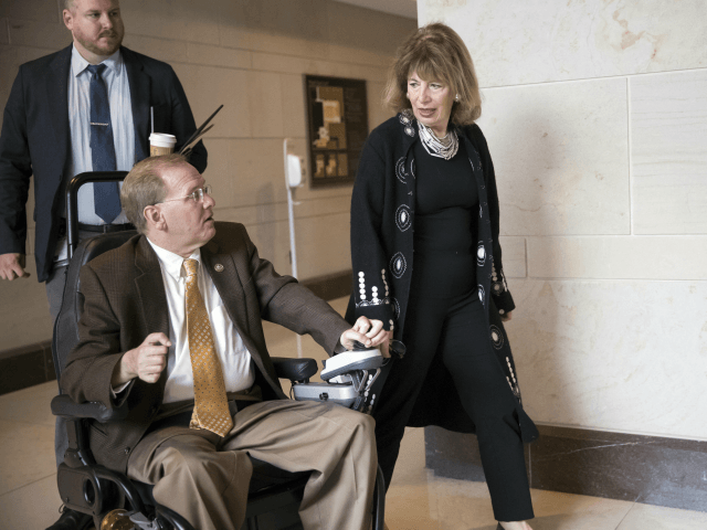 Rep. Jackie Speier, D-Calif., center, speaks with Rep. Jim Langevin, D-R.I., left, as they