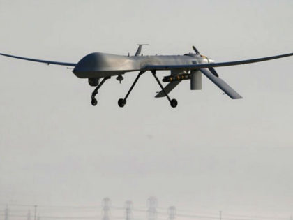 UNSPECIFIED, UNSPECIFIED - JANUARY 07: A U.S. Air Force MQ-1B Predator unmanned aerial vehicle (UAV), carrying a Hellfire missile lands at a secret air base after flying a mission in the Persian Gulf region on January 7, 2016. The U.S. military and coalition forces use the base, located in an …
