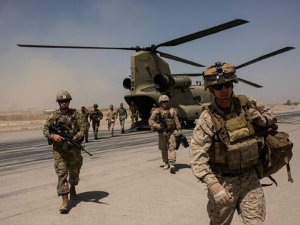 CAMP BOST, AFGHANISTAN - SEPTEMBER 11: U.S. service members walk off a helicopter on the r