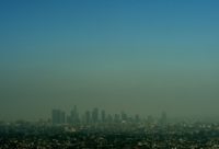 The smog-shrouded Los Angeles skyline is seen in this file photo from May 31, 2015. The latest US report says this current period in time is "the warmest in the history of modern civilization"
