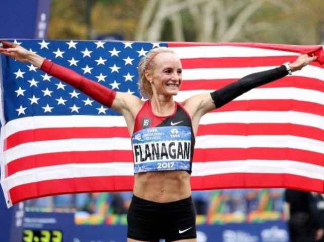 Shalane Flanagan of the United States celebrates winning the Professional Women's Division
