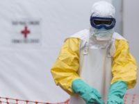 A health worker works at a Red Cross-run Ebola treatment center in Guinea, one of several West African nations where Red Cross officials committed fraud and misappropriated funds earmarked for Ebola relief AFP/File KENZO TRIBOUILLARD