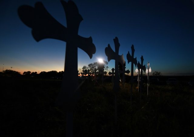 A row of crosses for victims of the mass shooting that killed 26 people at a church in Sut