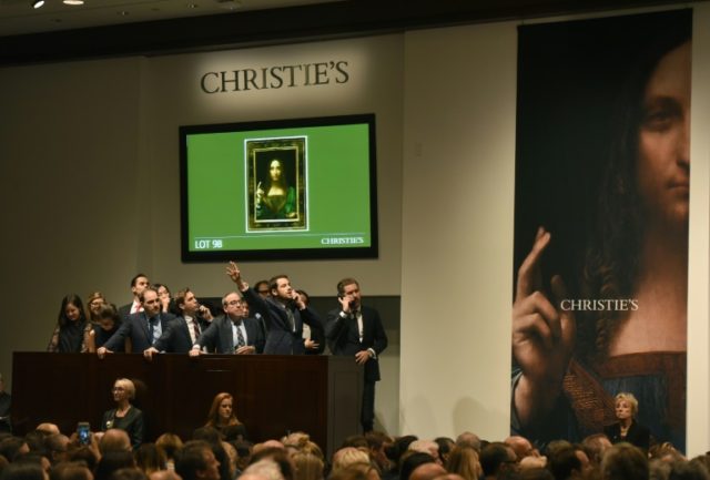 Christie's employees take bids for Leonardo da Vinci’s "Salvator Mundi" at Christie's Ne