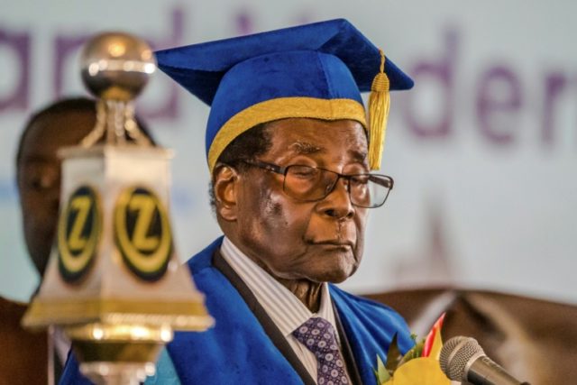 Zimbabwe's embattled President Robert Mugabe delivers a speech at a university graduation