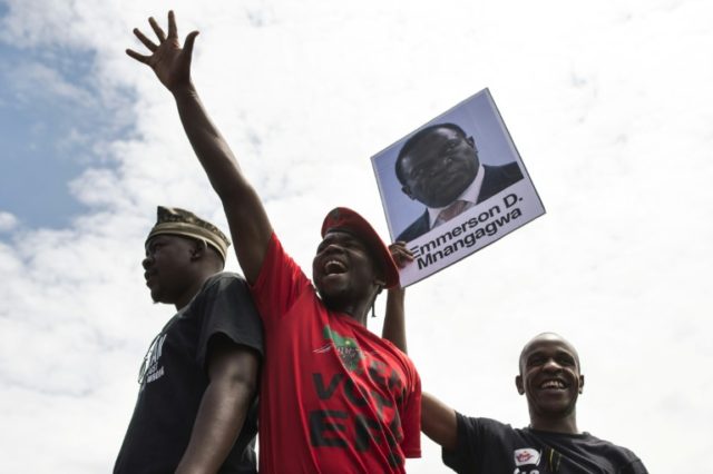 University of Zimbabwe students with a portrait of ousted vice president Emmerson Mnangagw