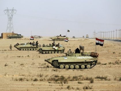Iraqi tanks advance through the desert towards the town of Al-Qaim on the Syrian border which they recaptured from the Islamic State group on November 3, 2017