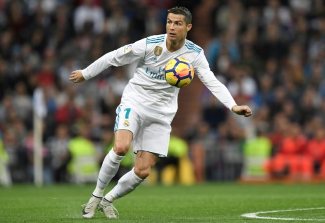 Real Madrid forward Cristiano Ronaldo controls the ball during their match against Malaga