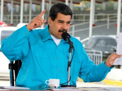 Venezuelan President Nicolas Maduro, seen here in a handout photo speaking during an event in Caracas, says he wants the debt-ridden state oil company restructured and has named a general to lead the effort