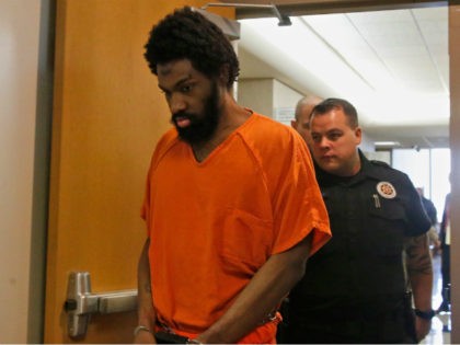 Alton Nolen is escorted from a courtroom following his formal sentencing in Norman, Okla., Friday, Dec. 15, 2017. Nolen was sentenced to death for beheading former Vaughan Foods employee Colleen Hufford, as well assaulting several other coworkers in 2014. (AP Photo/Sue Ogrocki)