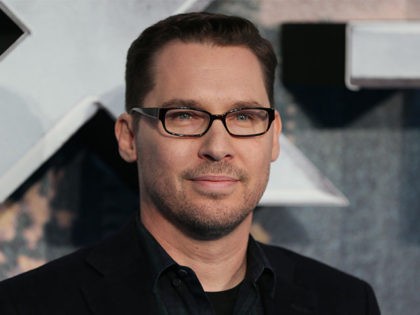 US director Bryan Singer poses on arrival for the premiere of X-Men Apocalypse in central