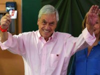 Chile-presidential-candidate-Sebastian-pinera-getty Chile's presidential candidate Sebastian Pinera (L) prepares to cast his vote, next to his wife Cecilia Morel, during the presidential run-off election in Santiago, Chile on December 17, 2017. About 14 million people are eligible to cast ballots at more than 43,000 polling stations, but the outcome of Sebastian Pinera's …