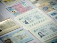 GettyImages-509326514 Fake passports are displayed at the immigration bureau in Bangkok on February 10, 2016 after Thai police broke up a major fake passport ring led by an Iranian known as 'The Doctor' which sent thousands of passports to Middle Eastern customers trying to enter Europe. Five years of investigation culminated …