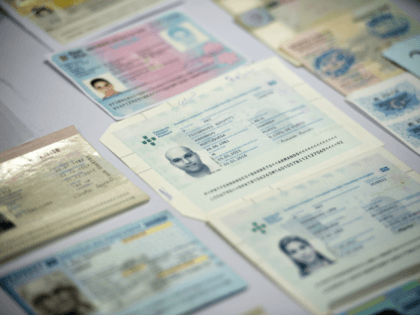 Fake passports are displayed at the immigration bureau in Bangkok on February 10, 2016 after Thai police broke up a major fake passport ring led by an Iranian known as 'The Doctor' which sent thousands of passports to Middle Eastern customers trying to enter Europe. Five years of investigation culminated …