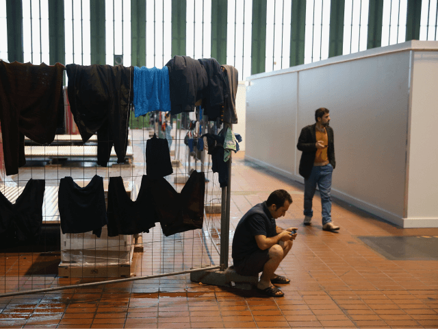 BERLIN, GERMANY - FEBRUARY 11: Laundry hangs to dry in Hangar 7 where refugees and migrant