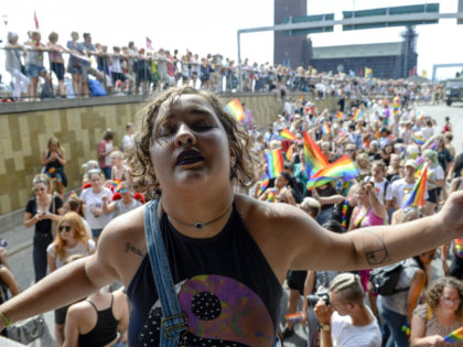 A young woman dances at the Pride parade in Stockholm on July 30, 2016. / AFP / TT NEWS AGENCY / Erik Nylander / Sweden OUT (Photo credit should read ERIK NYLANDER/AFP/Getty Images)