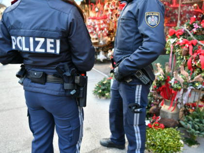 Policemen patrol over a Christmas market in Salzburg on December 20, 2016, as security mea