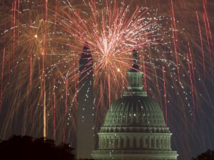 Fireworks explode over the National Mall as the US Capitol (R) and National Monument are seen on July 4, 2017, in Washington, DC. / AFP PHOTO / PAUL J. RICHARDS (Photo credit should read PAUL J. RICHARDS/AFP/Getty Images)