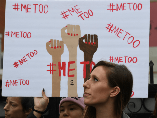 Victims of sexual harassment, sexual assault, sexual abuse and their supporters protest during a #MeToo march in Hollywood, California on November 12, 2017. Several hundred women gathered in front of the Dolby Theatre in Hollywood before marching to the CNN building to hold a rally. / AFP PHOTO / Mark …