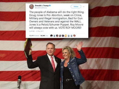 Republican Senatorial candidate Roy Moore stands with his wife Kayla Moore during a campai
