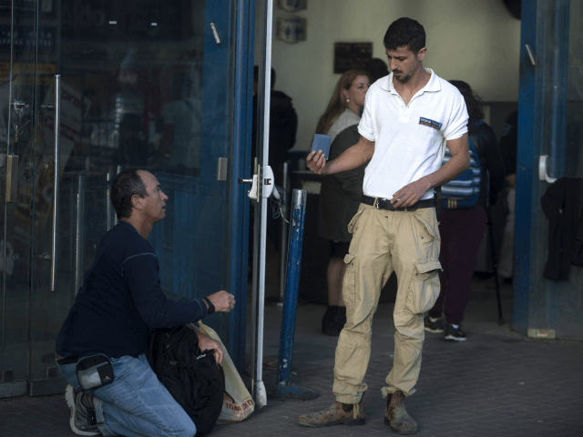 JERUSALEM, ISRAEL - DECEMBER 10: (ISRAEL OUT) Israeli security guard checks a man at the s