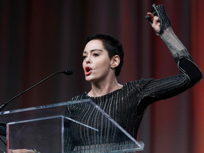 Actress Rose McGowan speaks at the inaugural Women's Convention in Detroit, Friday, Oct. 27, 2017. McGowan recently went public with her allegation that film company co-founder Harvey Weinstein raped her. (AP Photo/Paul Sancya)
