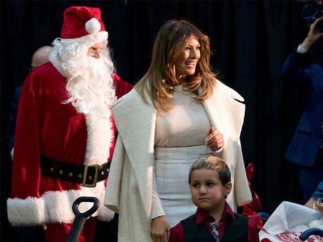 First lady Melania Trump accompanied by Santa Claus arrives to read The Polar Express to c