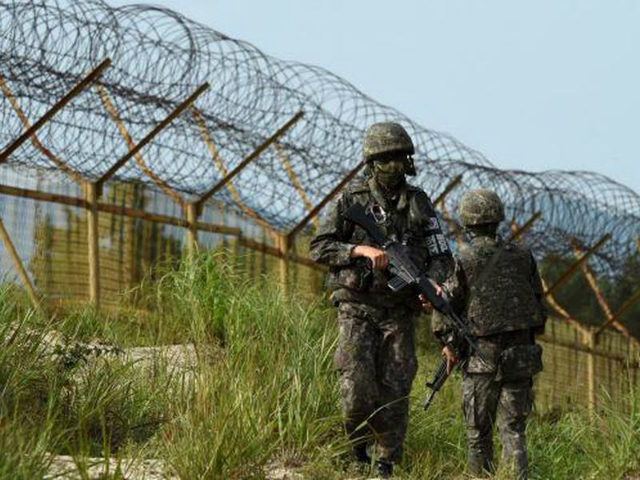 South Korea's military has fired warning shots at North Korean guards searching for a sold