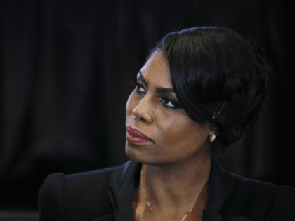 Omarosa Manigault, director of communications for the White House Office of Public Liaison, listens to Vice President Mike Pence speak during a listening session with the historically black colleges and universities at the Eisenhower Executive Office Building on the White House complex in Washington, Monday, Feb. 27, 2017. (AP Photo/Manuel …