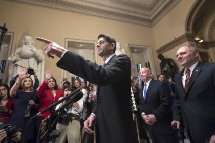 Speaker of the House Paul Ryan, R-Wis., joined at right by, House Ways and Means Committee Chairman Kevin Brady, R-Texas, and House Majority Whip Steve Scalise, R-La., speaks after passing the Republican tax reform bill in the House of Representatives, on Capitol Hill, in Washington, Tuesday, Dec. 19, 2017. Republicans …