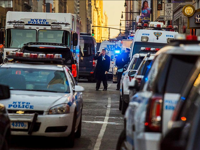 Police block a street by Port Authority Bus Terminal near New York’s Times Square following an explosion on Monday, Dec. 11, 2017. Police say the explosion happened in an underground passageway under 42nd Street between Seventh and Eighth Avenues. (AP Photo/Andres Kudacki)