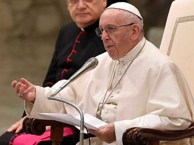 Pope Francis gestures as he speaks during his weekly general audience at the Aula Paolo VI