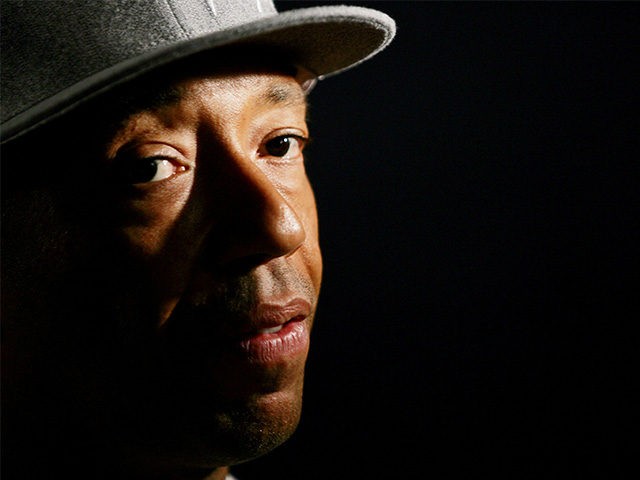 NEW YORK - MAY 3: Hip hop entrepreneur Russell Simmons talks to reporters following a pres