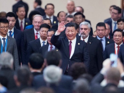 China's President Xi Jinping, centre, arrives with leaders at the opening ceremony of the