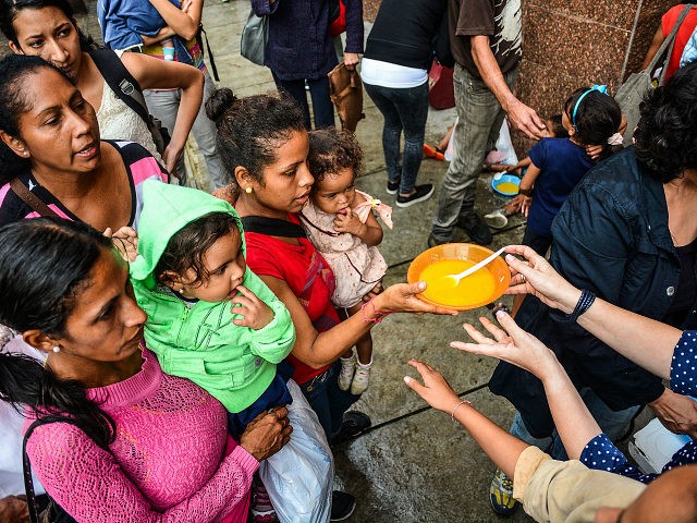 Hunger in Venezuela has worsened, non-governmental organizations and the Catholic Church have held food aid days to help people and children living on the streets or in extreme poverty in Caracas, Venezuela on 30 November 2017. (Photo by Roman Camacho/NurPhoto via Getty Images)