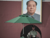 communism A Chinese paramilitary guard stands in front of a portrait of late communist leader Mao Zedong at the Forbidden City in Beijing on July 31, 2017, on the eve of the 90th founding anniversary of the People's Liberation Army (PLA). The PLA, originally called the Chinese Workers' and Peasants' Red …