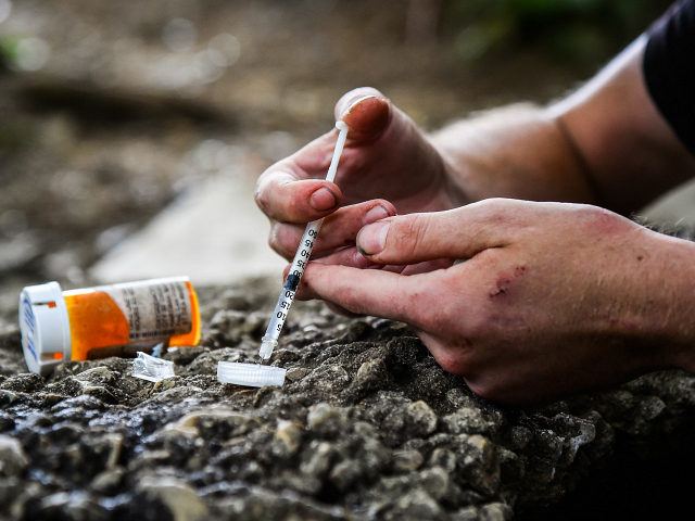 PHILADELPHIA, PA - JULY 27: Micheal Rouwhorst, 28, prepares a shot of heroin and cocaine near the train tracks along E Tusculum St on Thursday, July 27, 2017, in Philadelphia, PA. (Photo by Salwan Georges/The Washington Post via Getty Images)