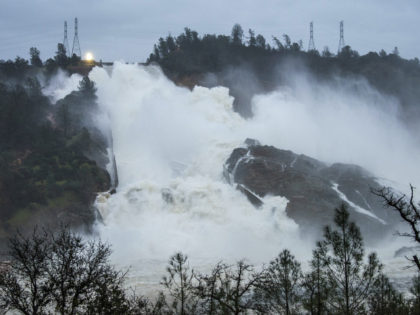 OROVILLE, CA - FEBRUARY 17: In this handout provided by the California Department of Water Resources (pixel.water.ca.gov), Water continues to move down the damaged spillway at Oroville Dam with an outflow of 80,000 cubic feet per second (cfs) on on February 17, 2017 in Oroville, California. Last weekend overflow waters …