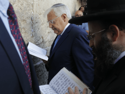 New US ambassador to Israel David Friedman (C) and Rabbi Shmuel Rabinovitch (R) pray at the Western Wall, the holiest site where Jews can pray, in the old city of Jerusalem on May 15, 2017. Controversial new US ambassador to Israel David Friedman arrived in the country to take up …