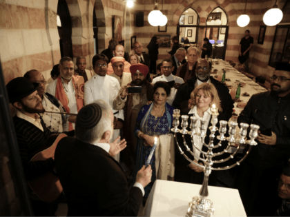 An interfaith group from the Gulf state of Bahrain attend Hannukah candle lighting in Jerusalem, Tuesday, Dec. 12, 2017. The 25 participants, which included Buddhists, Christians, Hindus, Sikhs, and both Sunni and Shiite Muslims, flew to Israel on Sunday as guests of the Simon Wiesenthal Center, a U.S.-based Jewish human …