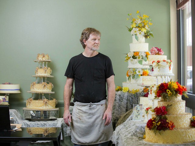 LAKEWOOD, CO - SEPT 1: Jack Phillips stands for a portrait near a display of wedding cakes