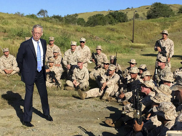 Defense Secretary Jim Mattis talks to U.S. Marine Corps troops at a rifle range at Guantan