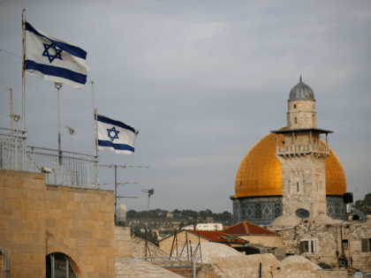 Israeli flags fly near the Dome of the Rock in the Al-Aqsa mosque compound on December 5,