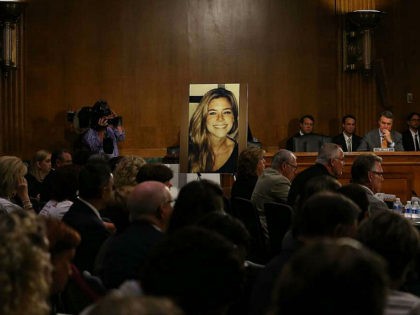 WASHINGTON, DC - JULY 21: A large photo of Kathryn 'Kate' Steinle who was killed by an illegal immigrant in San Francisco, is shown while her dad Jim Steinle testifies during a Senate Judiciary Committee hearing on Capitol Hill, July 21, 2015 in Washington, DC. The committee heard testimony from …