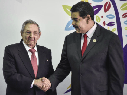 Nicolas Maduro, president of Venezuela, right, and Raul Castro, president of Cuba, shake hands during the Non-Aligned Movement (NAM) Summit in Margarita, Venezuela, on Saturday, Sept. 17, 2016. Venezuela on Tuesday kicked off the the 17th summit of the Non-Aligned Movement on Margarita Island as it attempts to divert attention …