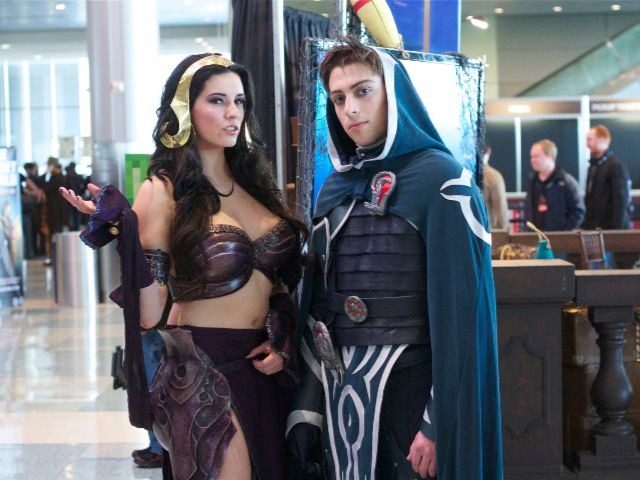 two cosplayers show off their costumes of Magic: the Gathering characters