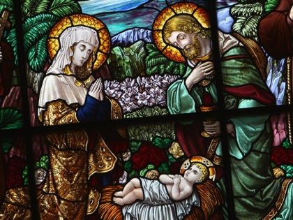 A nativity scene is displayed in the stained-glass window in St. Catherine's Church D