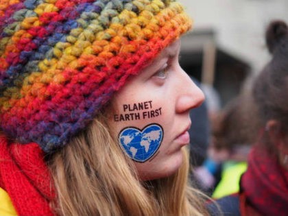 BONN, NORTH RHINE-WESTPHALIA, GERMANY - 2017/11/04: 'Planet Earth First' written on a girl's face. With the motto 'keep coal in the ground' thousands of activists took to the streets demanding Climate Justice two days ahead of the United Nations Framework Convention on Climate Change - UNFCCC - COP23. (Photo by …