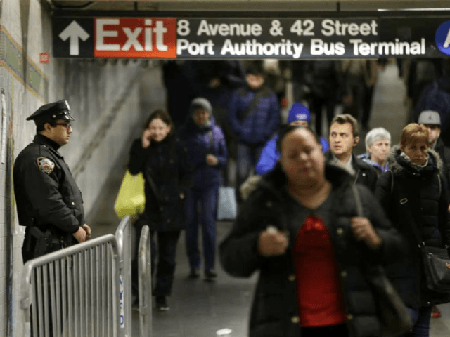 A police officer stands in the passageway connecting New York City's Port Authority bus te