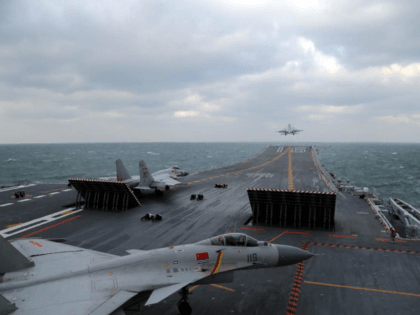 This photo taken on December 23, 2016 shows Chinese J-15 fighter jets being launched from the deck of the Liaoning aircraft carrier during military drills in the Yellow Sea, off China's east coast. Taiwan's defence minister warned on December 27 that enemy threats were growing daily after China's aircraft carrier …